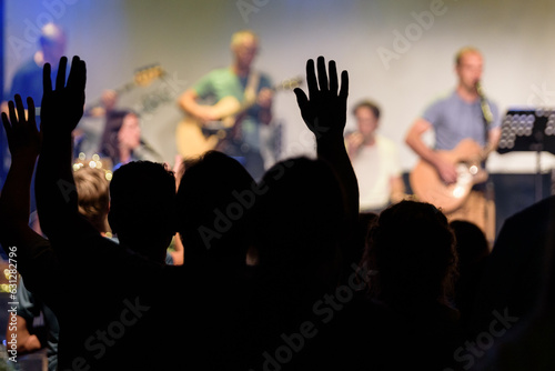 Christians raising their hands in praise and worship.