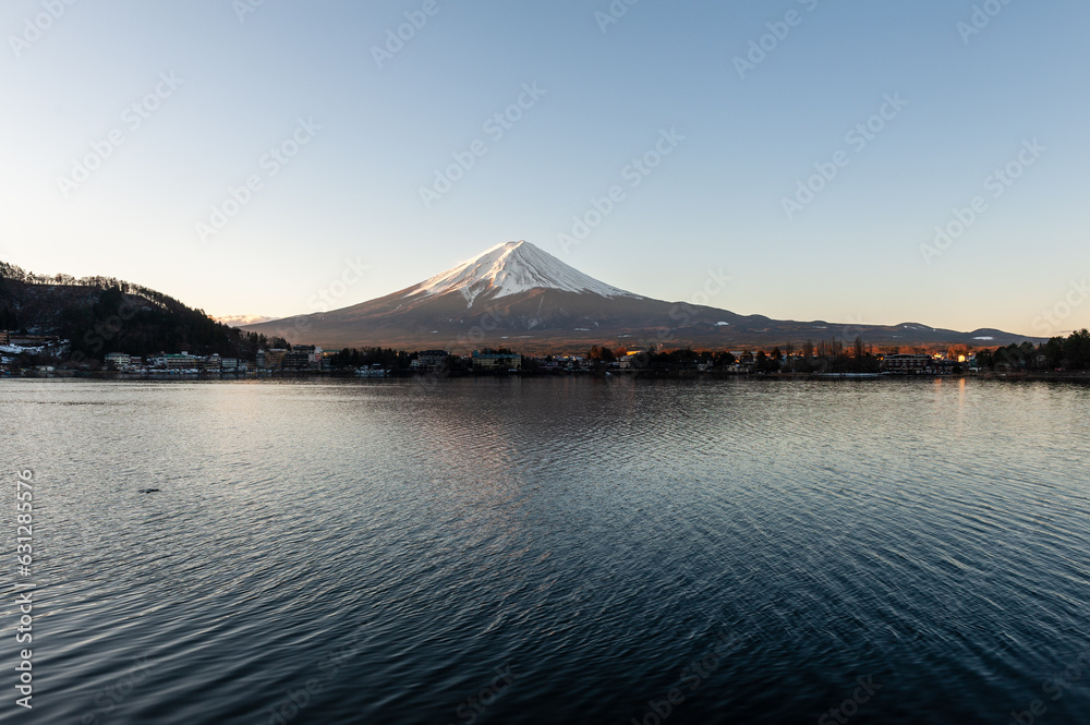 Mount Fuji on a bright winter morning, as seen from across lake Kawaguchi, and the nearby town of Kawaguchiko.