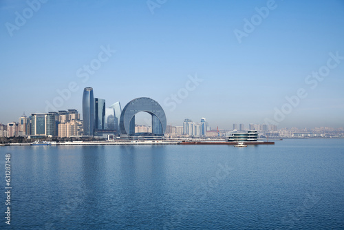Baku, Azerbaijan, March 2023. View of the business center "The Crescent Bay" and "Port Baku" from the embankment of the Baku Bay. Baku boulevard.