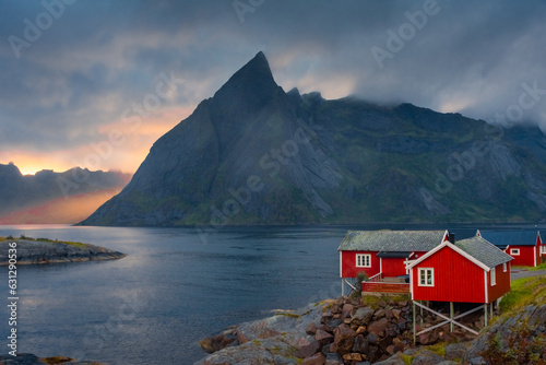 Принти на полотні Amazing sunset through the mist and the Reinebringen Mount over the red houses o