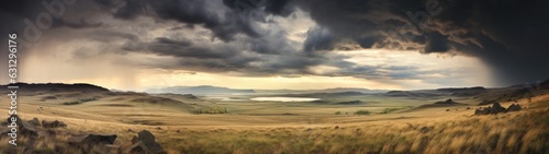 Panoramic image of a vast, windswept grassland under a stormy sky, a vast landscape under a dramatic stormy sky, where sunlight pierces through, illuminating the golden fields.