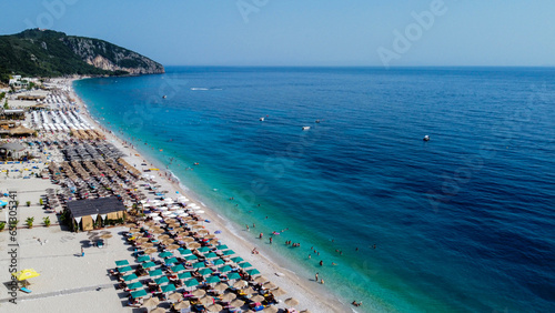 Aerial view of Dhermi, Albania 2023. Beautiful colorful Coastline of Ionian Sea. Popular beach for tourism.