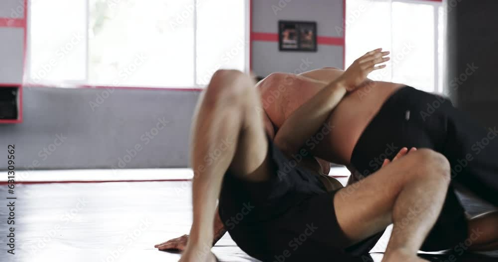 Gym, fitness and jiu jitsu fight by men on floor for training, sport and physical or endurance challenge. Wrestling, fighting and male person with personal trainer for technique coaching or speed