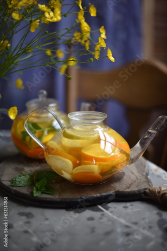 Orange tea, lemon tea, health tea with lemon and orange and mint.