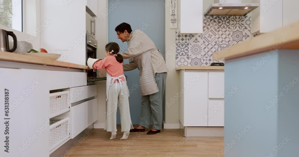 Kitchen, oven and baking grandma and child load cookie tray, sweets or biscuits for breakfast, lunch or brunch dessert. Home support, senior woman and young kid girl learning cooking from grandmother