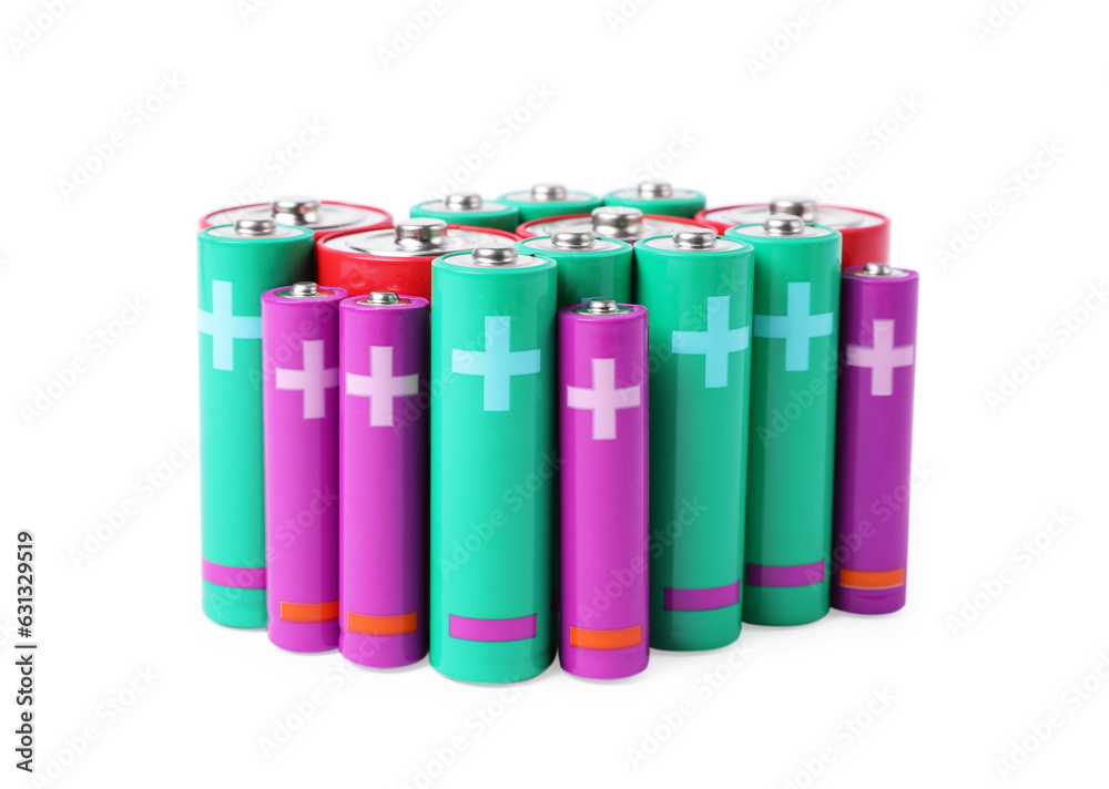 Many different new batteries isolated on white Many different new batteries isolated on white