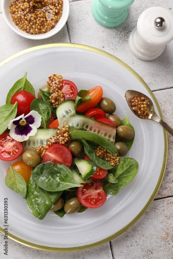 Delicious salad with vegetables, olives and grain mustard on light table, flat lay Delicious salad with vegetables, olives and grain mustard on light table, flat lay