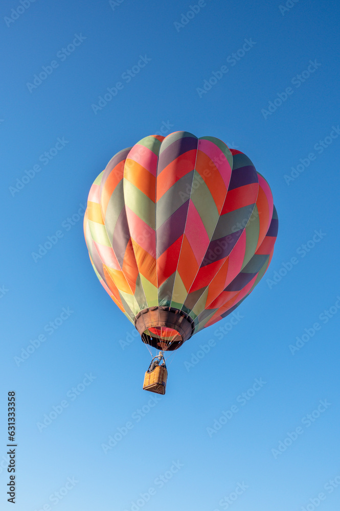 Flying balloons in the blue sky, Adirondack, Queensbury, New York. colorful hot air balloons and blue sky as background. Flying balloons in the blue sky, Adirondack, Queensbury, New York. colorful hot air balloons and blue sky as background.