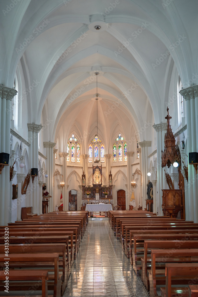 The interior of Cristo Pobre Church, a beautiful entrance with a high and white ceiling is displayed, one of the most beautiful churches in the town.