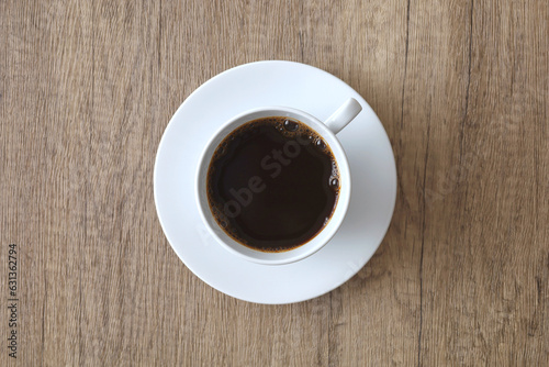 Coffee cup americano on wooden background. Top view, flat lay
