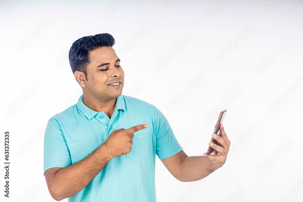 Indian man using smartphone on white background. Indian man using smartphone on white background.