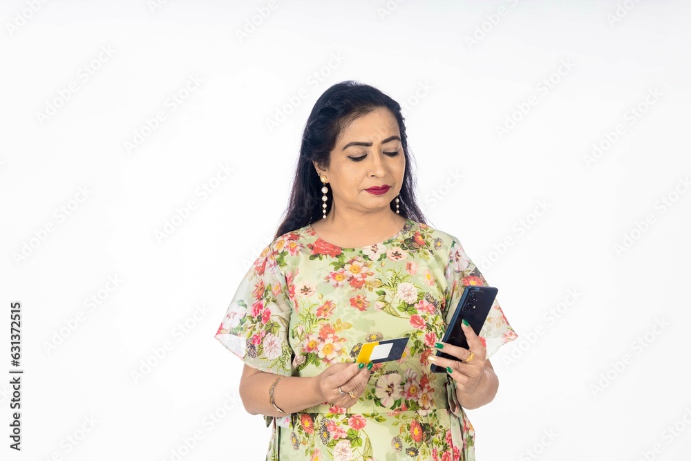 Indian woman using smartphone on white background. Indian woman using smartphone on white background.