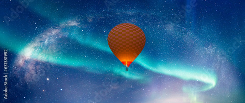 Hot air balloon flying over aurora borealis with our galaxy is Milky way spiral galaxy 