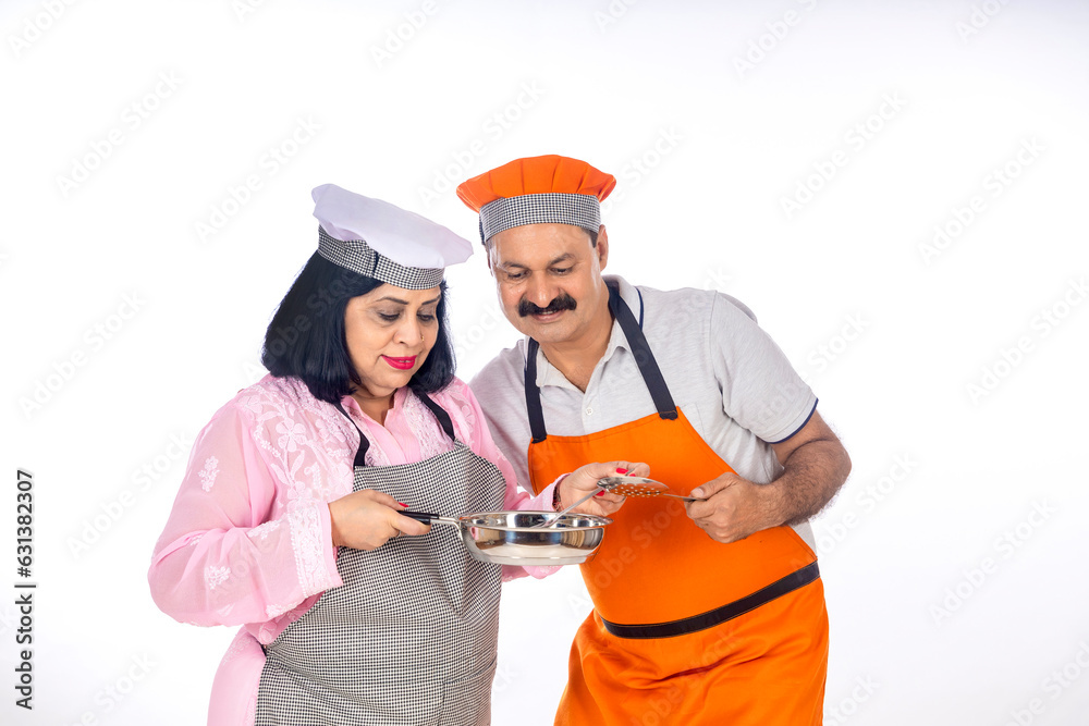 Indian happy chefs or cooks couple on white background Indian happy chefs or cooks couple on white background