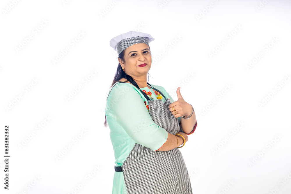 Indian female chef giving happy expression on white background. Indian female chef giving happy expression on white background.