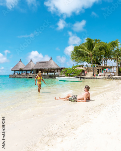 Man and Woman on a tropical beach in Mauritius, a couple on a honeymoon vacation in Mauritius