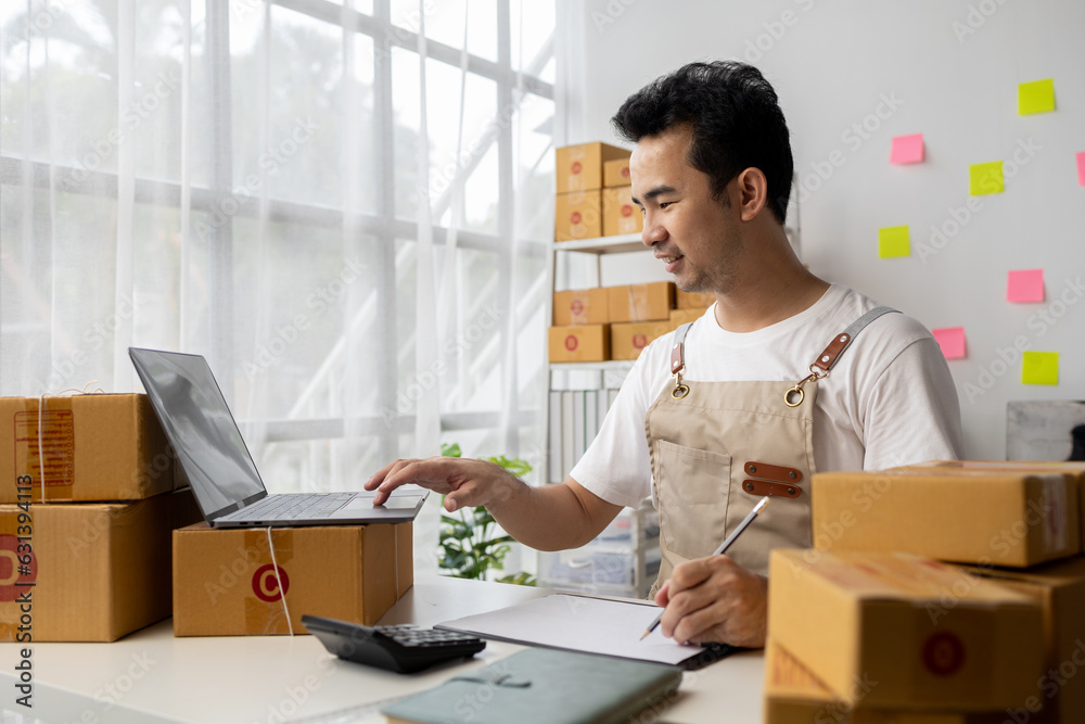 Online shop owner man, he checks orders on website, online shop owner distributes products on site, packs orders and delivers by private courier. Online shopping concept. e commerce.