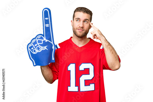 sports fan man over isolated chroma key background having doubts and thinking