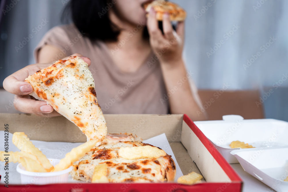 Binge eating disorder concept with woman overeating fast food pizza