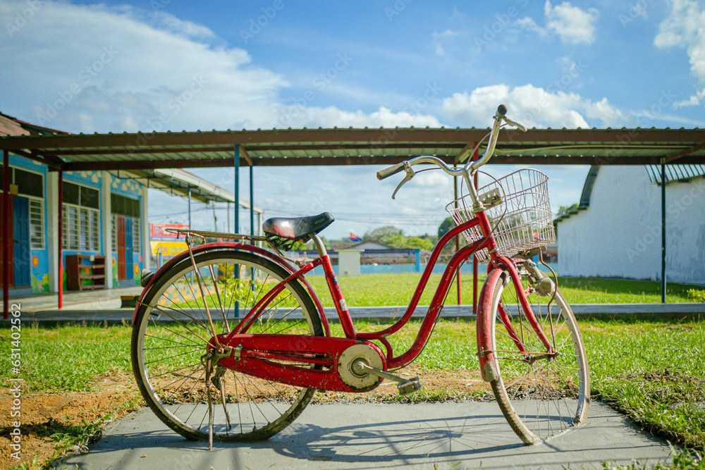 Old bicycle is being used as decoration at school.