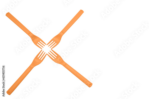 Four orange plastic forks for camping  travel isolated on white surface