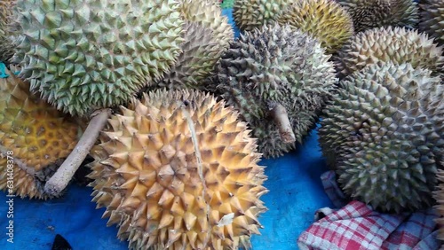 fresh durian fruit sold in Indonesian traditional market photo