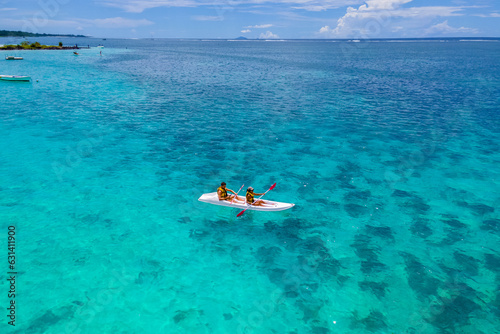 Fotografie Mauritius vacation, couple man and woman in a kayak in a blue ocean in Mauritius