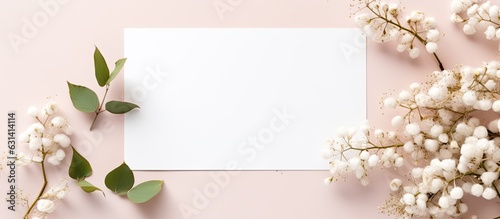A mockup featuring a wedding invitation or greeting card with natural eucalyptus and gypsophila © HN Works