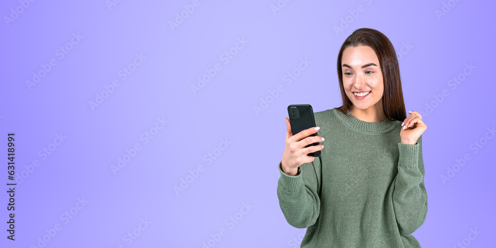 Smiling beautiful college student using smartphone Smiling beautiful college student using smartphone