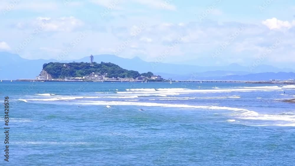 Enoshima Island and surfers in the sea in Shonan area Japan on a hot summer day
Enoshima Island and surfers in the sea in Shonan area Japan on a hot summer day
