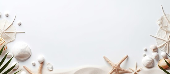 White sand frame adorned with eucalyptus leaves, seashells, and a starfish, featuring a cord for