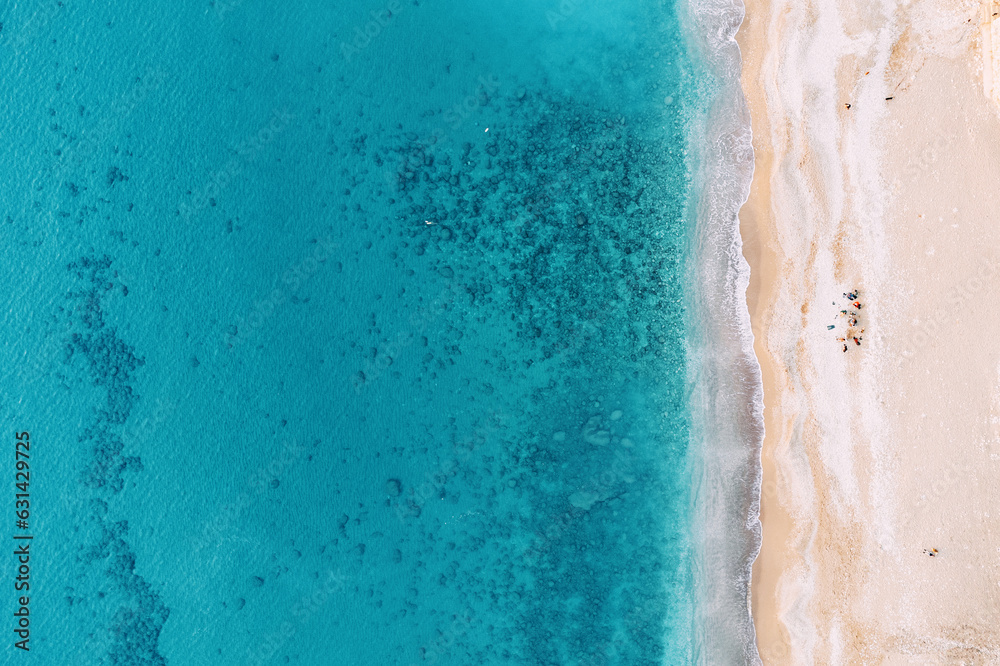 aerial view showcases a breathtaking beach paradise, inviting viewers to embark on a dreamy vacation escape. From above, the scene reveals a pristine expanse of golden sand meeting turquoise waters.
