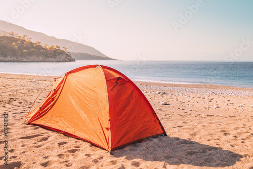 Serenity awaits along the Lycian Way as a camping tent finds its place on a picturesque beach  promising an escape into coastal bliss.
