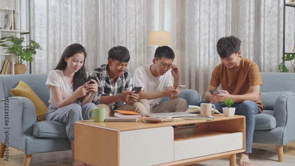 Asian Teen Group With Books And A Laptop Using Smartphone, Break Time After Studying At Home
Asian Teen Group With Books And A Laptop Using Smartphone, Break Time After Studying At Home