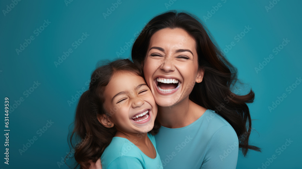 Mother and daughter hugging and laughing against a blue background. Created with Generative AI technology. Mother and daughter hugging and laughing against a blue background. Created with Generative AI technology.