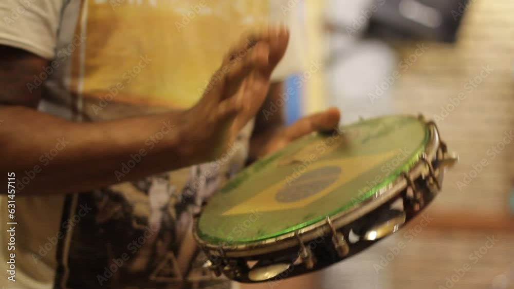 playing tambourine, percussion instrument