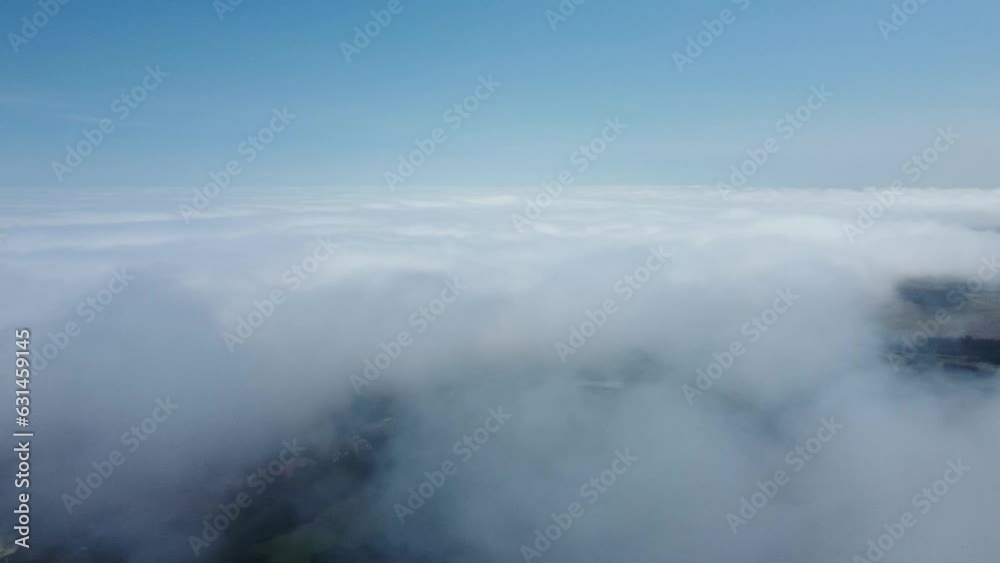 white cirrus, feathery clouds against spring bright blue cloudy sky on sunny day in England white cirrus, feathery clouds against spring bright blue cloudy sky on sunny day in England