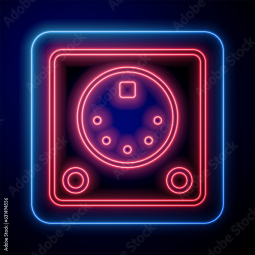 Glowing neon Drum machine icon isolated on black background. Musical equipment. Vector