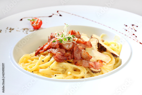 delicious carbonara white milk cream paste w bacon and mushroom in white plate on white background premium western cafe halal food menu for restaurant