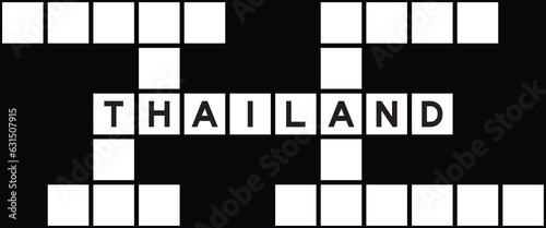 Alphabet letter in word thailand on crossword puzzle background