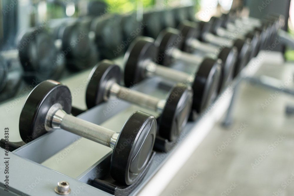 Row of Dumbbell indoor gym. Weight training equipment and bodybuilder concept. Sport club with heavy Weight workout for Muscular. Row of Dumbbell indoor gym. Weight training equipment and bodybuilder concept. Sport club with heavy Weight workout for Muscular.