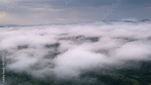 Wallpaper Mural 4K motion time lapse video aerial view morning scenery Mist flowing over the high mountains The movement of fog and clouds, Pang Puey, Mae Moh, Lampang, Thailand	 Torontodigital.ca