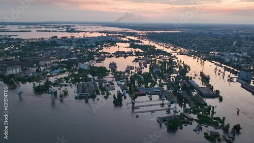 Top aerial view. The city of Kherson, Ukraine after the explosion on the Kakhovka dam. Flooded city and streets aerial view from above. Russian-Ukrainian war.  photo