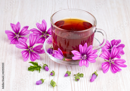 Mallow herb (Malva Vulgaris) mallow flower tea in cup.