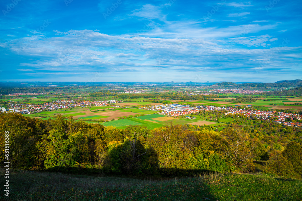 Germany, Wide view, swabian alb nature landscape, bissingen unter teck city houses, sunny day autumn colorful, blue sky sun, breitenstein mountain