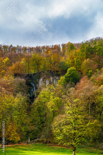 Obraz na płótnie Germany, Colorful autumn mood forest trees nature landscape meadow mountain at bad urach waterfall w salonie