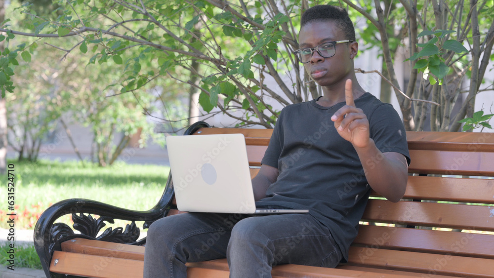 Young African Man in Denial while Working on Laptop Outdoor Young African Man in Denial while Working on Laptop Outdoor
