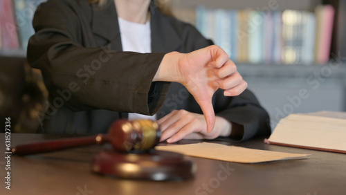 Close Up of Thumbs Down by Female Judge in Court  Scale on Justice