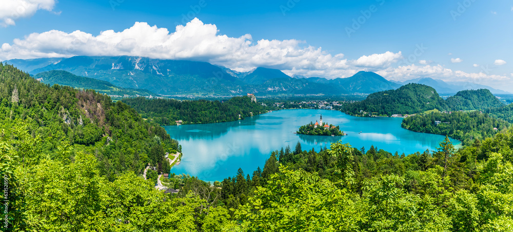 A panorama view from the Ojstrica viewpoint over Lake Bled and the village of Bled, Slovenia in summertime