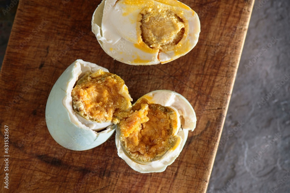 Exquisite Delicacy: 4K Close-Up of Salted Duck Boil Egg Resting on Wooden Surface Exquisite Delicacy: 4K Close-Up of Salted Duck Boil Egg Resting on Wooden Surface